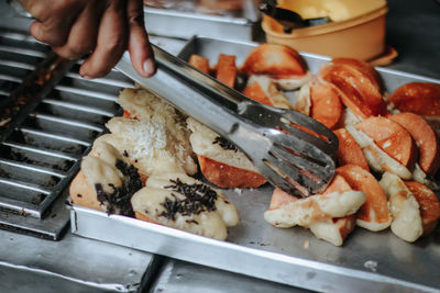 Cropped hand preparing food