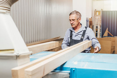 Portrait of man working on table