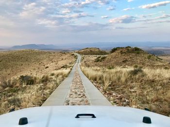 Road amidst landscape against sky