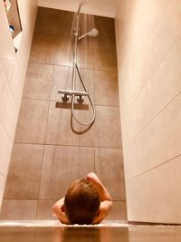 High angle view of child in bathroom