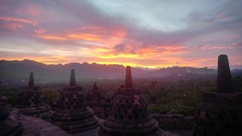 Ancient temple against sky during sunset