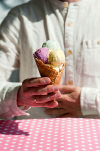 Hand holding ice cream cone