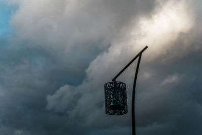 Low angle view of streetlight against sky