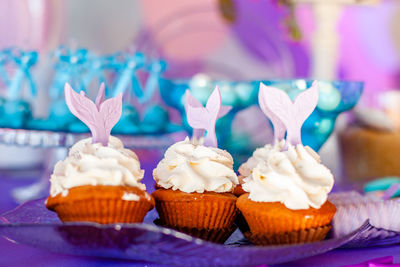 Close-up of cupcakes on table