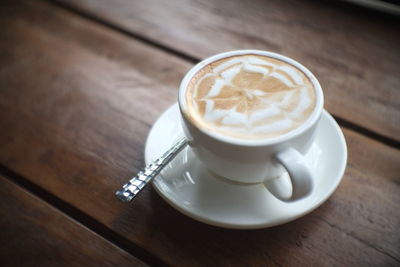 High angle view of coffee cup on table