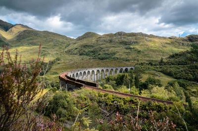 Scenic view of bridge over landscape against sky