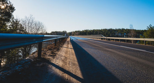 Railroad track against clear sky