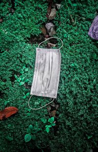 High angle view of shoes hanging on field