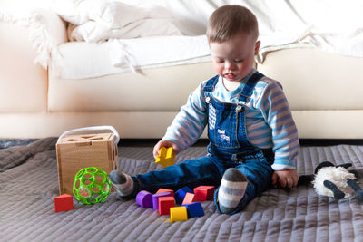 Close-up of cute physically impaired boy with toy