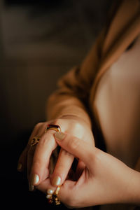 Midsection of woman holding snake