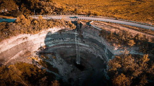 High angle view of road amidst trees