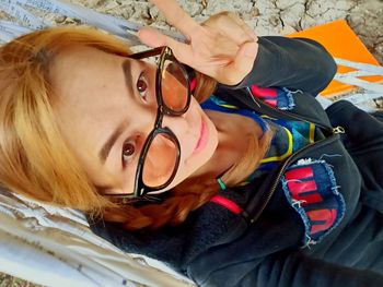 Portrait of young woman lying down