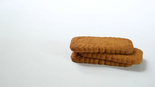 High angle view of cleaning brush against white background