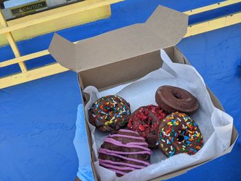 High angle view of candies in box on table