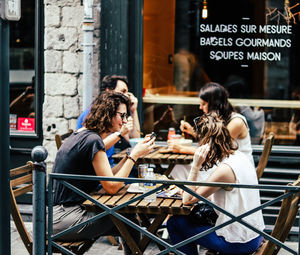 Group of people sitting at cafe