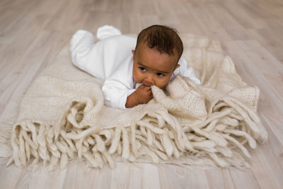 Portrait of cute baby relaxing at home
