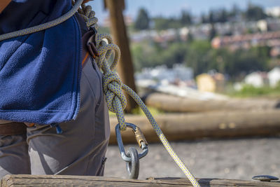 Midsection of person with rope