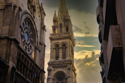 Low angle view of buildings against sky in city