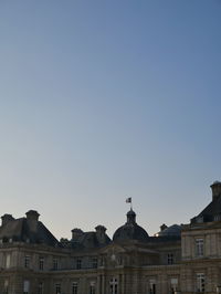 Low angle view of buildings against clear sky