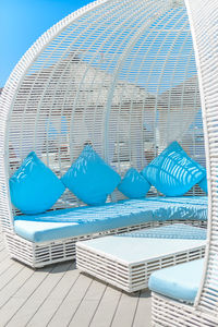 Lounge chairs by swimming pool