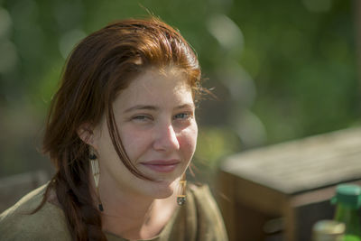 Close-up portrait of smiling young woman