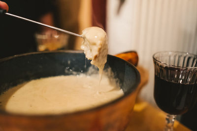 Close-up of cheese fondue in bowl on table