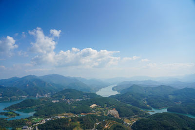 Scenic view of mountains against blue sky