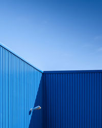 Low angle view of building against blue sky
