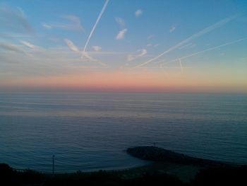 Scenic view of sea against sky at sunset