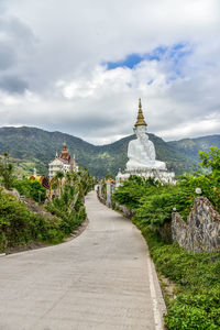 Panoramic view of temple amidst buildings against sky