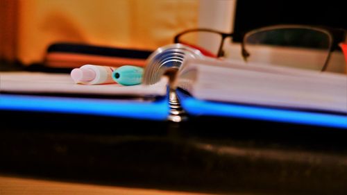 Close-up of machine part on table