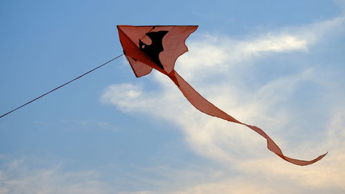 Low angle view of flags against sky