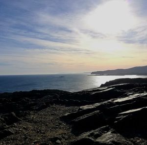 Scenic view of sea against sky at sunset