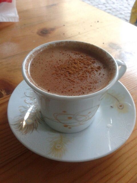 drink, food and drink, coffee cup, refreshment, table, indoors, coffee - drink, saucer, freshness, still life, coffee, frothy drink, cup, close-up, high angle view, cappuccino, wood - material, spoon, wooden, no people