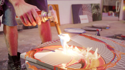 Low angle view of people on cutting board