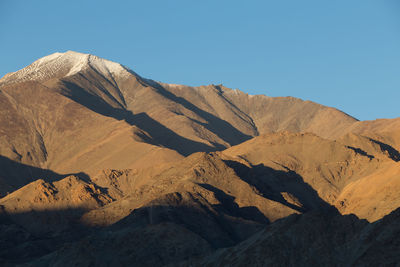 Scenic view of mountains against clear sky