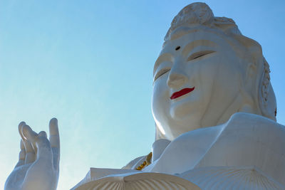 Low angle view of statue against sky