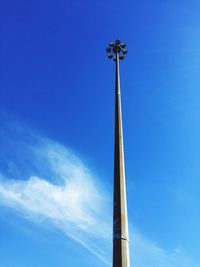 Low angle view of street light against blue sky