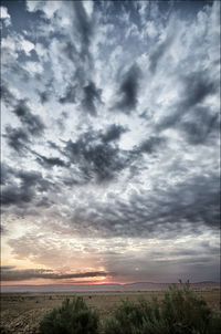 Scenic view of dramatic sky over landscape