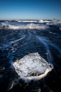 Picture of a shiny ice formation on the diamond beach in the jokulsarlon lagoon in iceland