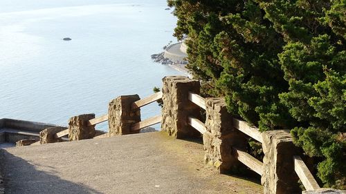 Built structure by sea against sky