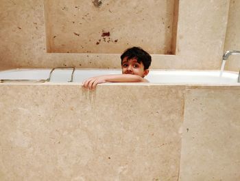 Portrait of boy in bathroom