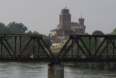 View of bridge over river against clear sky