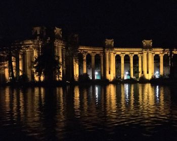 Reflection of illuminated buildings in water at night