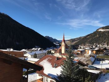 Buildings in town against sky