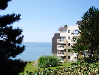 Scenic view of calm sea against clear blue sky