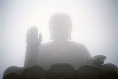 Rear view of silhouette man against clear sky