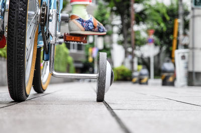 Low section on person riding bicycle on footpath