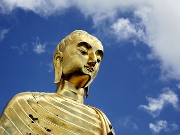 Low angle view of statue against sky