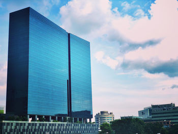 Low angle view of modern buildings against sky